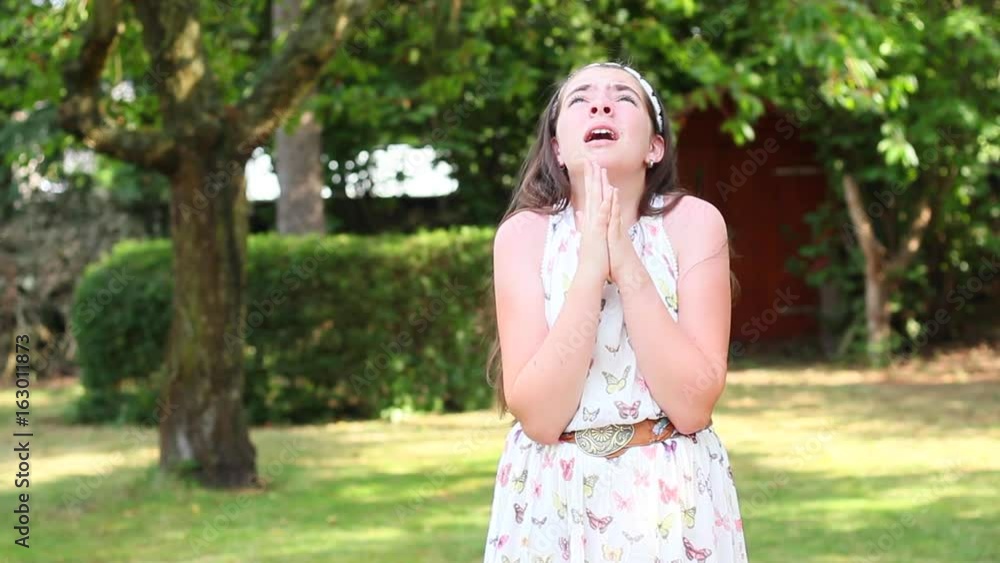 custom made wallpaper toronto digitalGirl prays in park. Regrets and looks at the sky.