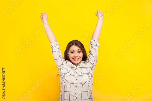 Happy woman posing in victory