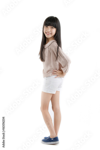 Portrait of Happy long hair little Asian child smiling isolated on white background