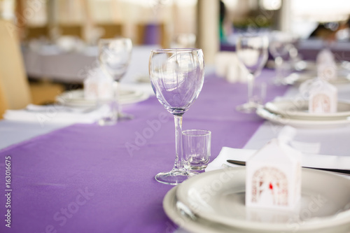 Beautiful flowers, candles and bonbonniere on table in wedding day.Blue color decoration tablecloth