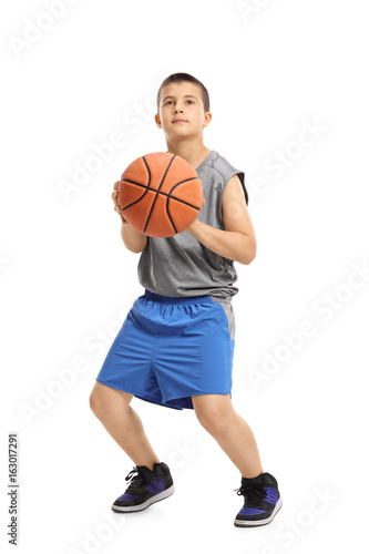 Boy about to throw a basketball