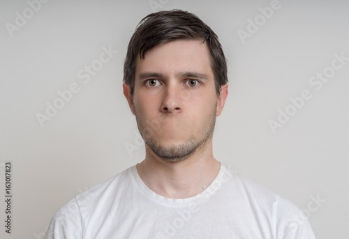 Face of young man without mouth. Censorship concept.