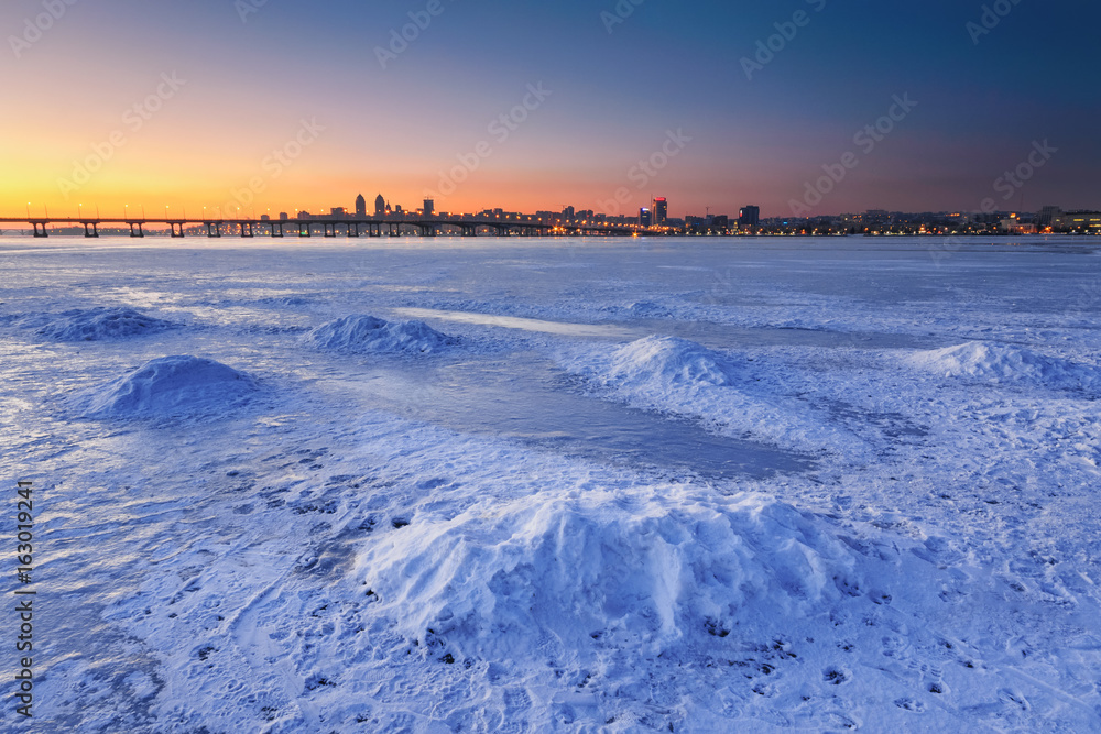 Beautiful winter landscape with frozen river at Dusk III