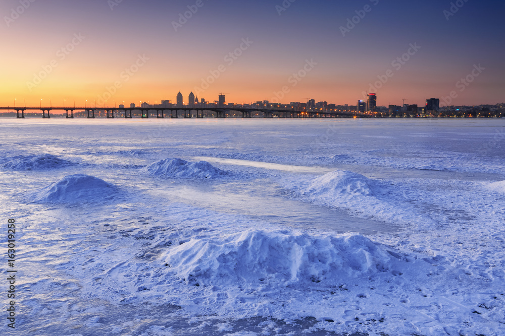 Beautiful winter landscape with frozen river at Dusk II Beautiful winter landscape with frozen river at Dusk II