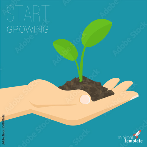 hand holding soil with growing sprout. 