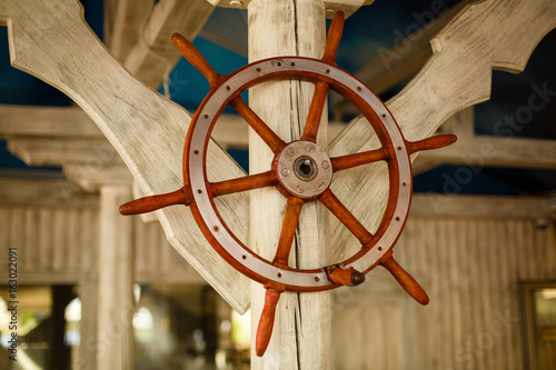 steering wheel of ship as decoration photo