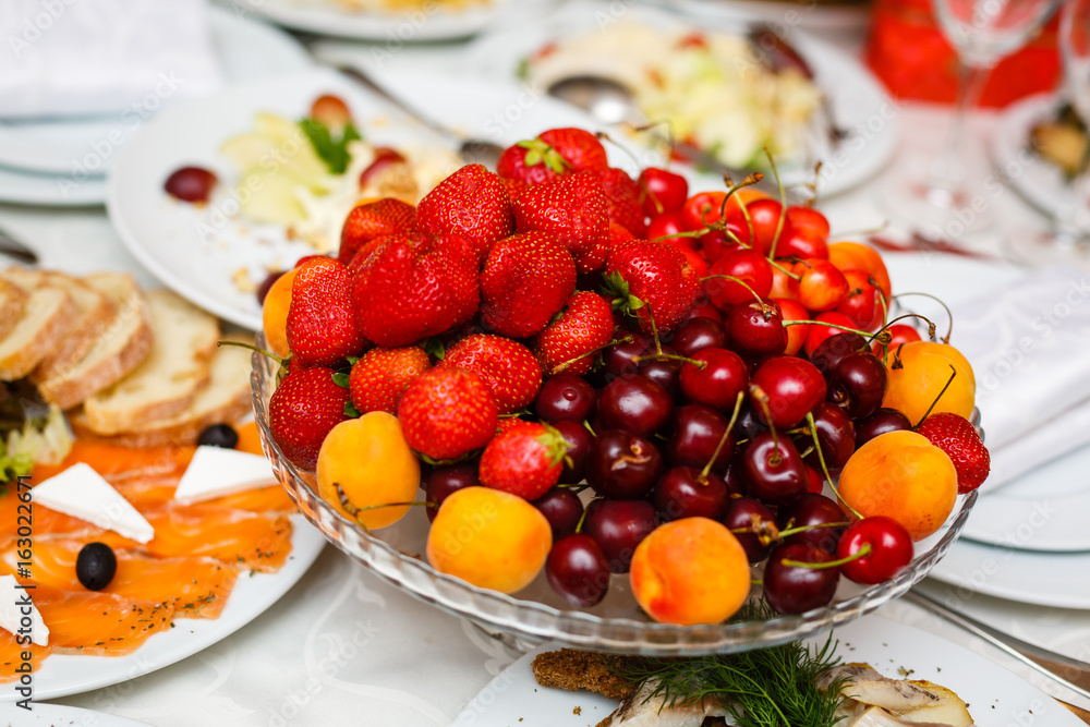 Wedding table fruit decoration at restaurant, pineapple, strawberry, grape Strawberry grapes buffet table Wedding table fruit decoration at restaurant, pineapple, strawberry, grape Strawberry grapes buffet table