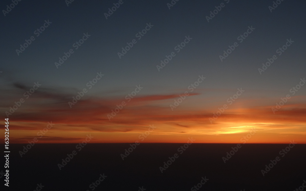 Sunrise seen from airplane Sunrise seen from airplane