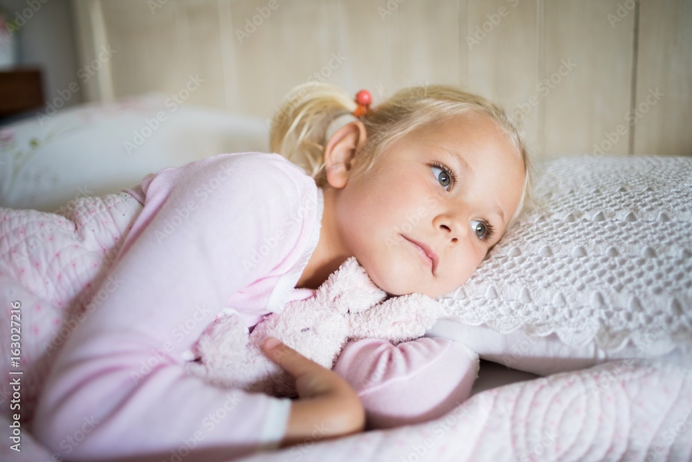 Girl relaxing on bed in the bedroom at home Girl relaxing on bed in the bedroom at home