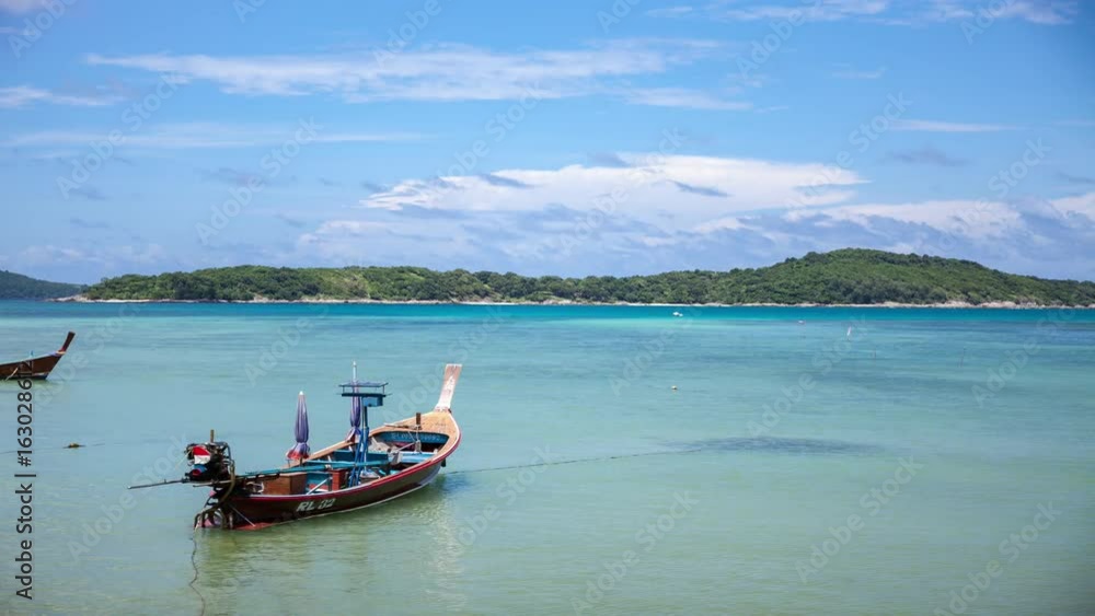 Thai Longtail fisherman boat at rawai beach Phuket Thailand,time lapse Thai Longtail fisherman boat at rawai beach Phuket Thailand,time lapse