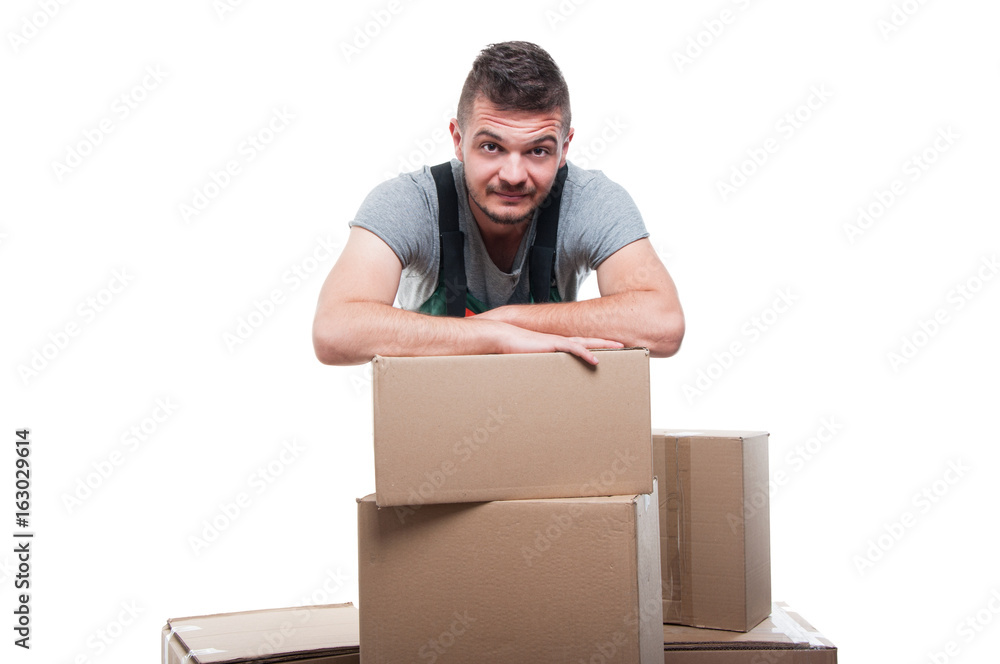 Portrait mover man posing behind cardboard boxes Portrait mover man posing behind cardboard boxes