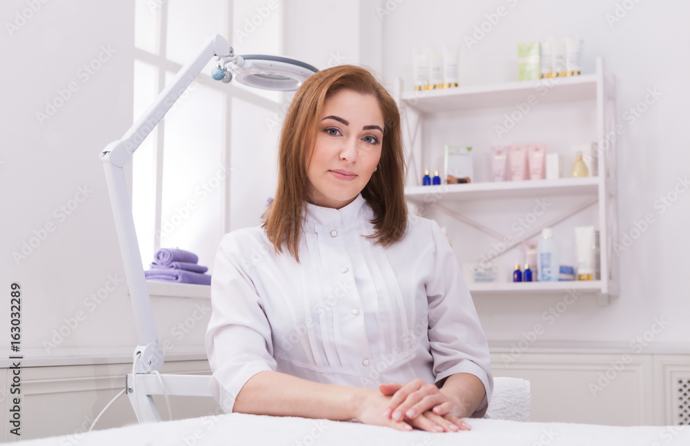 Woman beautician doctor at work in spa center Woman beautician doctor at work in spa center