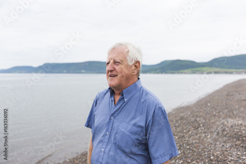 Senior Man at the beach having good time