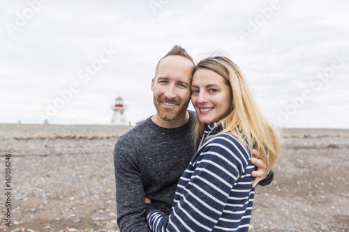 portrait of living young couple at the beach