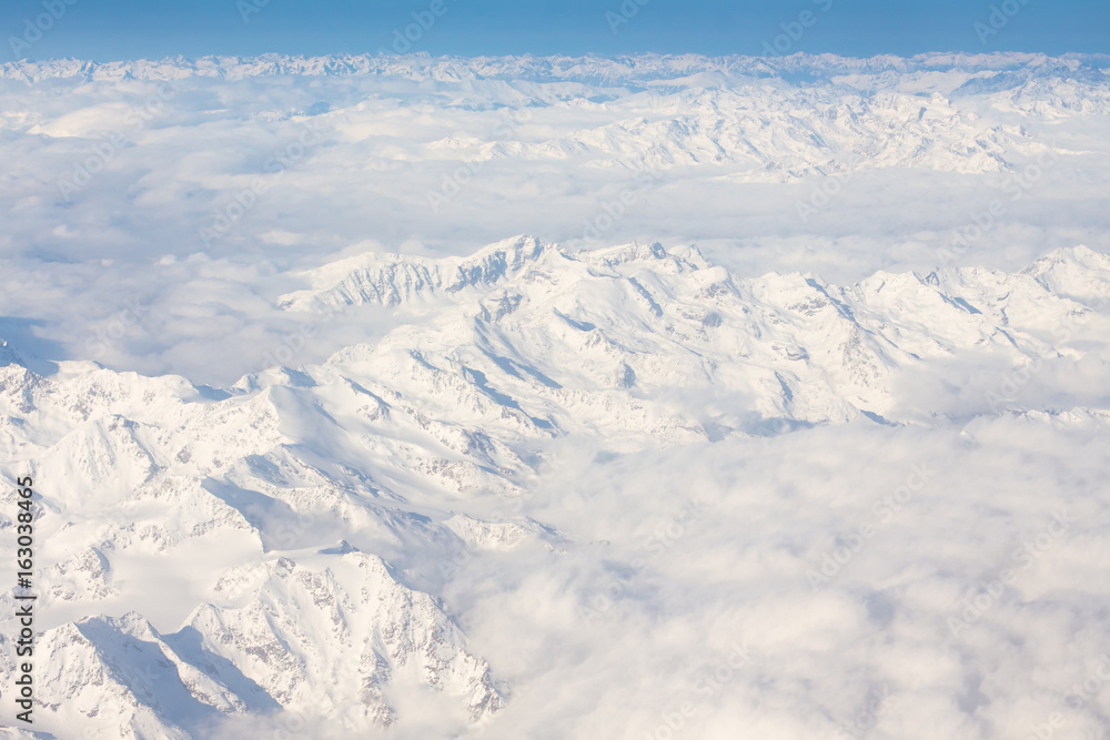 Alps - aerial view from window of airplane Alps - aerial view from window of airplane