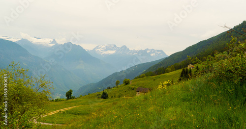 Fototapeta Naklejka Na Ścianę i Meble -  Mountain landscape with a house in the Swiss alps in the summer.