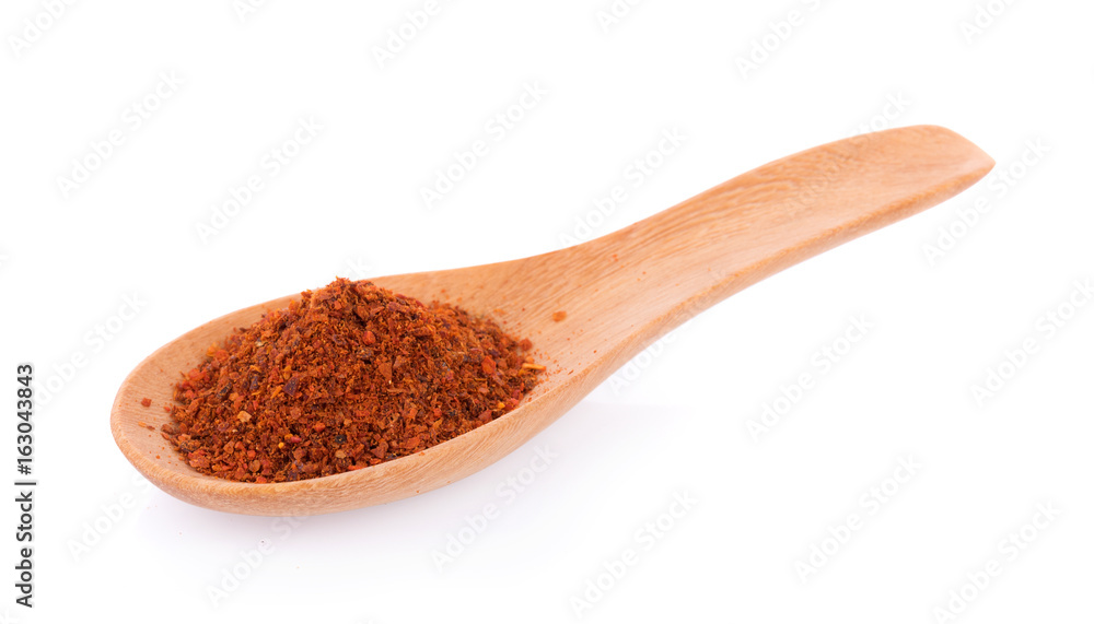Pile of red paprika powder on spoon wooden Pile of red paprika powder on spoon wooden
