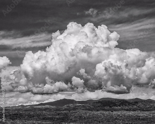 Black and white cumulus cloud over colorado mountains