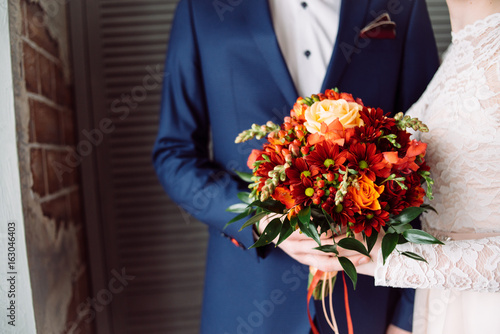 beautiful wedding bouquet with red flowers photo