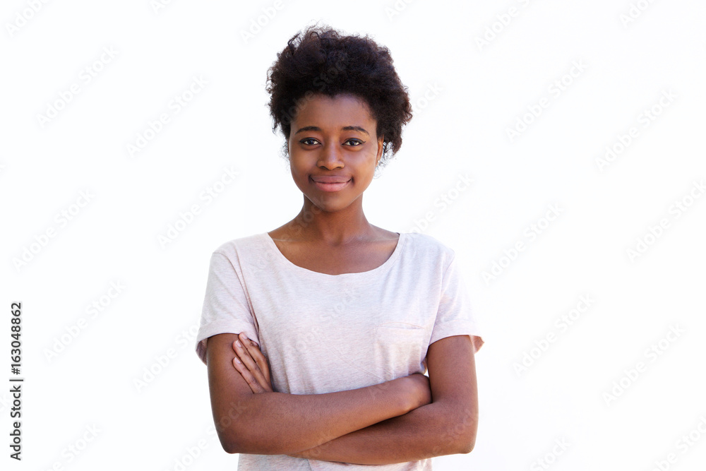 Young african woman standing with arms crossed against white background