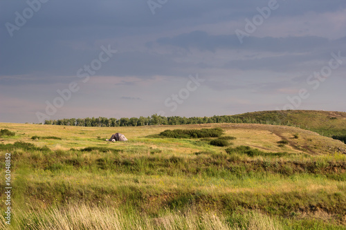 landscape with tent and green hills. travel concept © dvulikaia