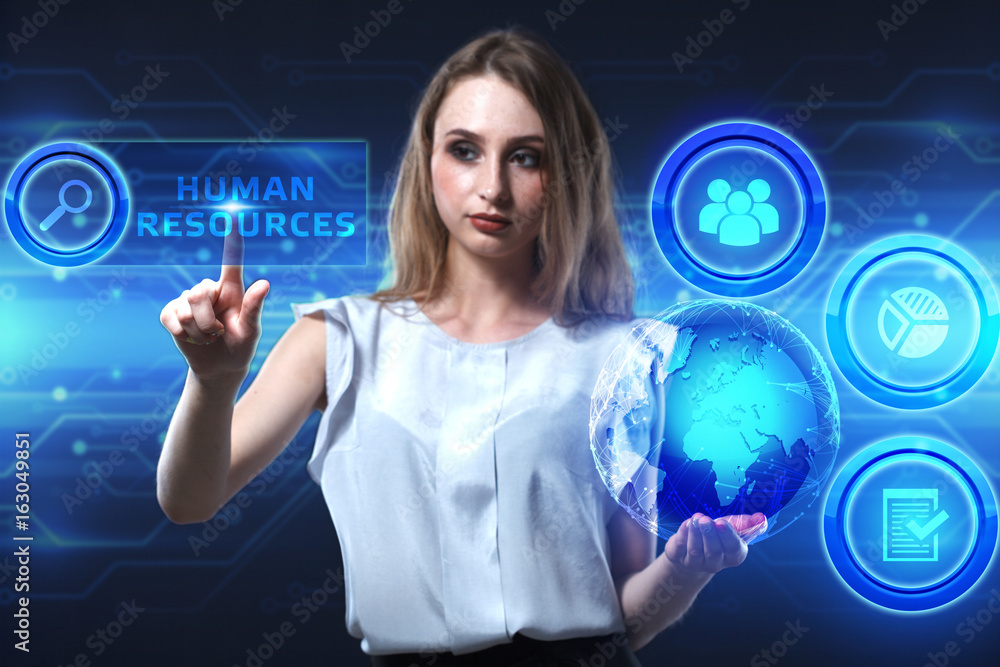 The concept of business, technology, the Internet and the network. A young entrepreneur working on a virtual screen of the future and sees the inscription: Human resources The concept of business, technology, the Internet and the network. A young entrepreneur working on a virtual screen of the future and sees the inscription: Human resources