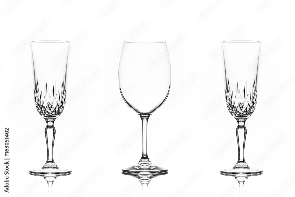 One wine glass and one champagne glass to each side on white background
