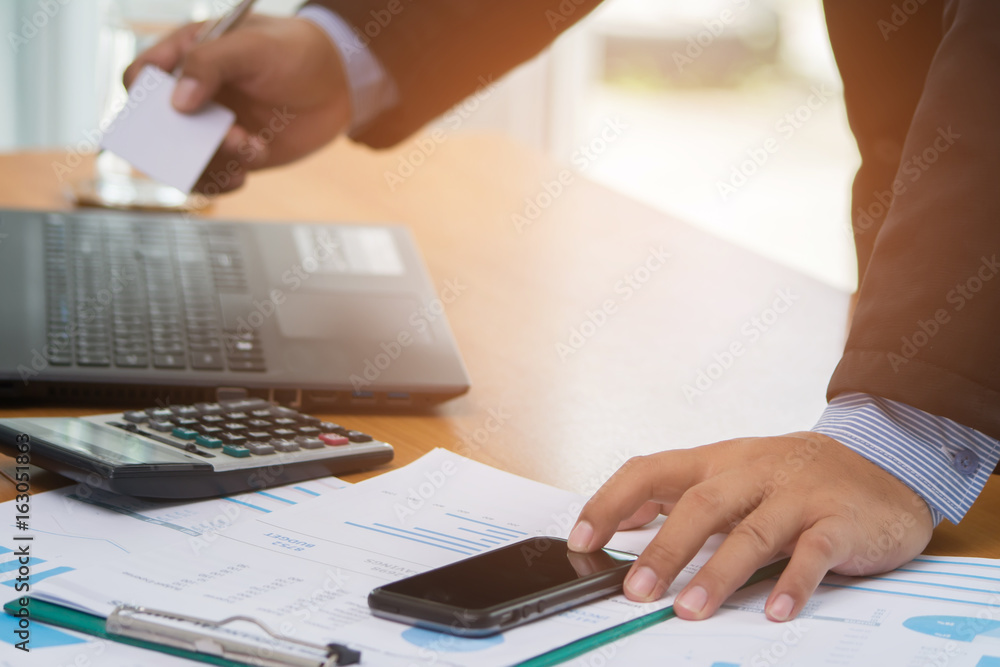 Businessman using smart phone and using credit card for online shopping. Online shopping concept. Businessman using smart phone and using credit card for online shopping. Online shopping concept.