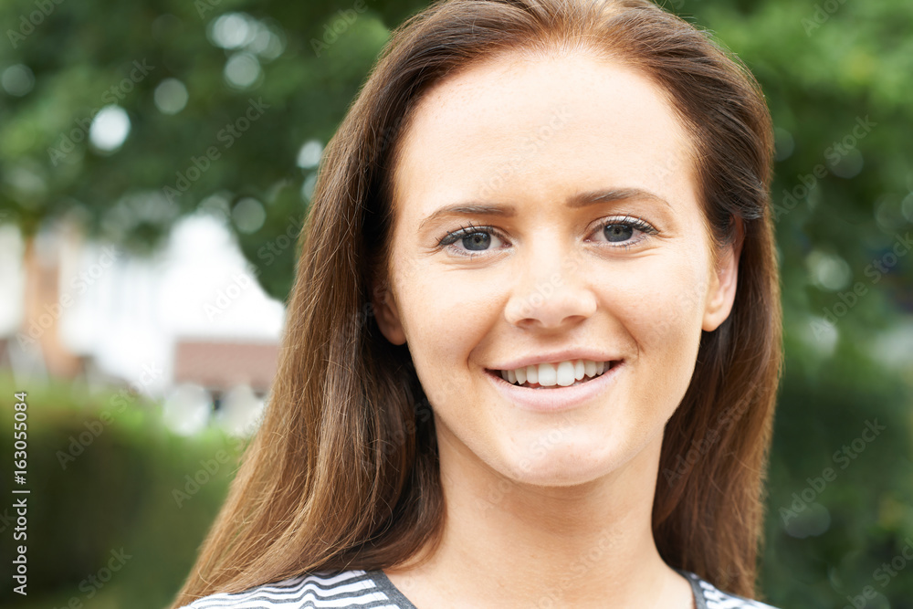 Outdoor Head And Shoulders Portrait Of Smiling Teenage Girl Outdoor Head And Shoulders Portrait Of Smiling Teenage Girl