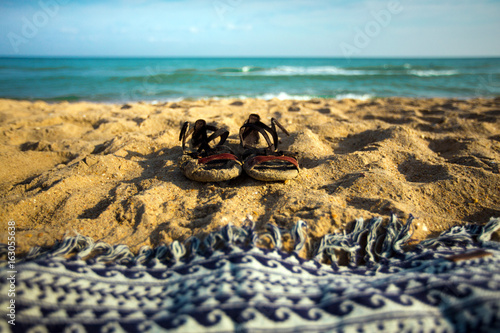 Summer Footwear And Plaid On The Sand Beach, Closeup Summer Vacation Concept