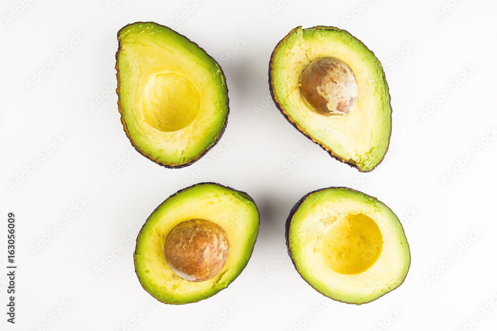 Fresh Pieces Of Avocados On White Background Fresh Pieces Of Avocados On White Background