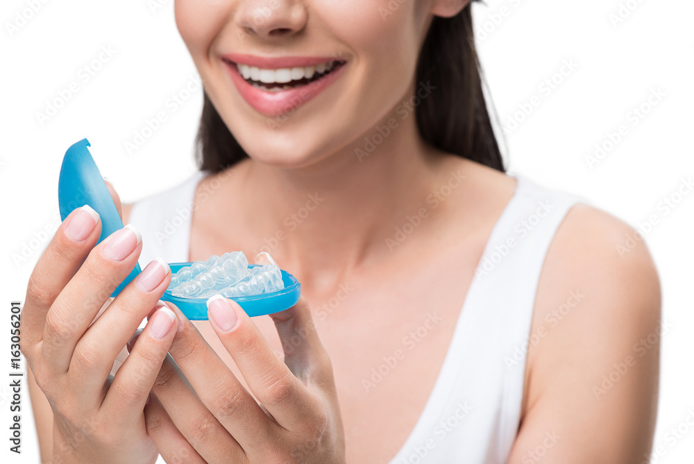 Joyful young woman is ready for clear-aligner treatment Joyful young woman is ready for clear-aligner treatment
