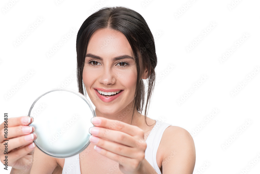 Attractive girl admires her facial beauty Attractive girl admires her facial beauty
