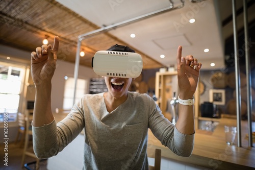 Man using virtual reality headset in restaurant