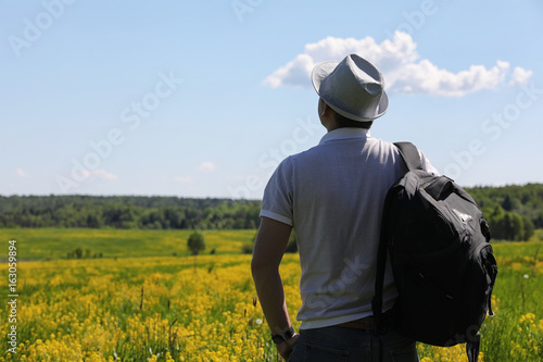 Young man travels with a backpack