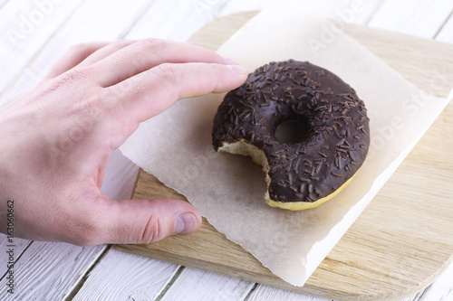 Chocolate Donut on a wooden white background