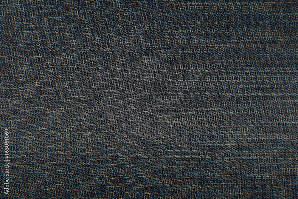 Dark blue denim jeans fabric texture for background or concept Dark blue denim jeans fabric texture for background or concept