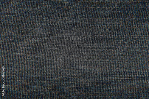 Dark blue denim jeans fabric texture for background or concept