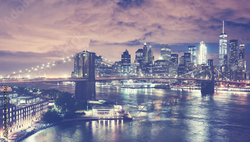 Vintage toned picture of New York City skyline at night, USA. © MaciejBledowski