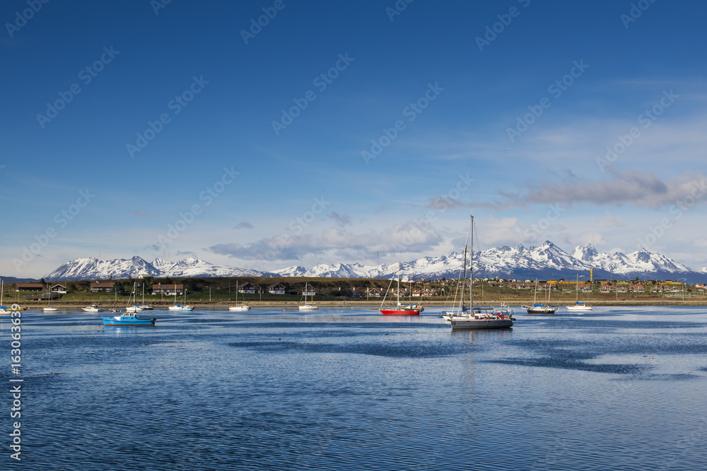 Boats in the bay in front of the city of Ushuaia, in Tierra del Fuego, Argentina