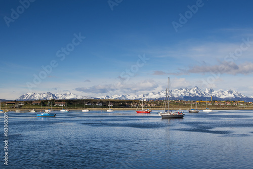 Boats in the bay in front of the city of Ushuaia  in Tierra del Fuego  Argentina