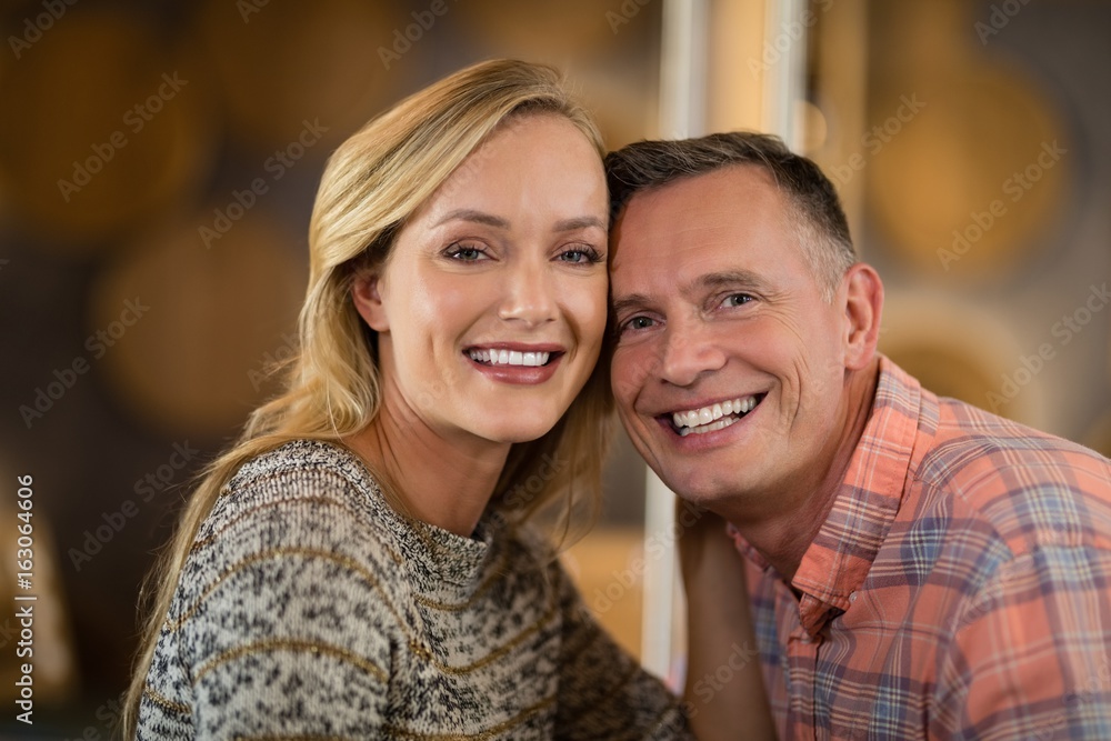 Couple looking at camera in bar Couple looking at camera in bar