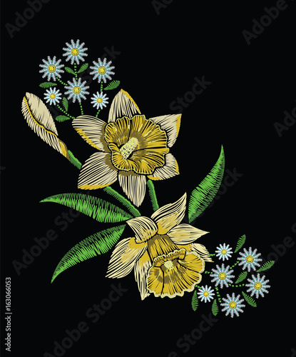 Fototapeta Naklejka Na Ścianę i Meble -  Embroidery stitches with yellow narcissus daffodil, chamomile in pastel color. Vector fashion ornament on black background for traditional floral decoration. Pattern for textile and fabrics.