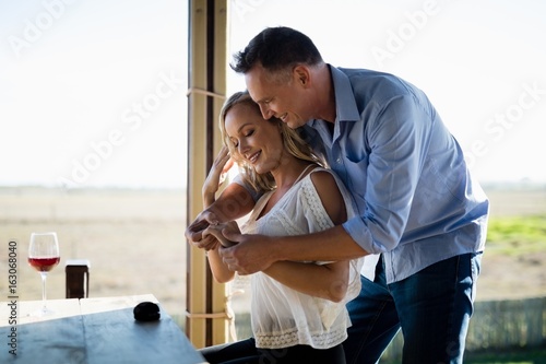 Photography Smiling man wearing engagement ring to woman
