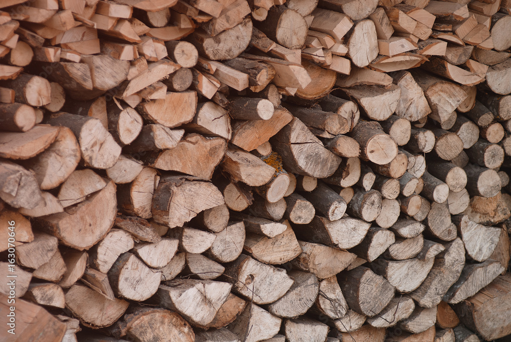 A pile of chipped firewood for the fireplace A pile of chipped firewood for the fireplace