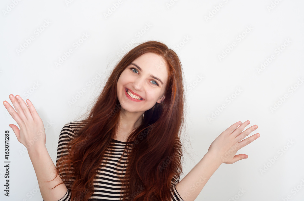 Beautiful excited and happy girl with hands up. Smiling and looking into the camera. Beautiful excited and happy girl with hands up. Smiling and looking into the camera.