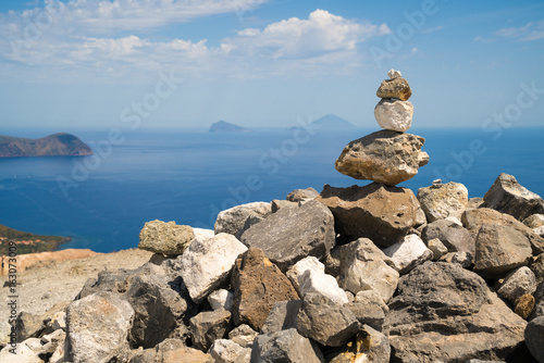 Piled up stones building a cairn on the large crater of Vulcano Island © Lux