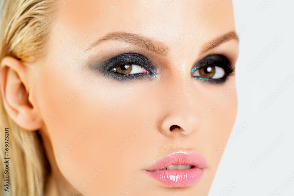 Beautiful woman with clean skin, lipstick make-up and white teeth. Fashion photo of beautiful young woman close up portrait. Close up shot of stylish young woman model. Beauty portrait of female face Beautiful woman with clean skin, lipstick make-up and white teeth. Fashion photo of beautiful young woman close up portrait. Close up shot of stylish young woman model. Beauty portrait of female face