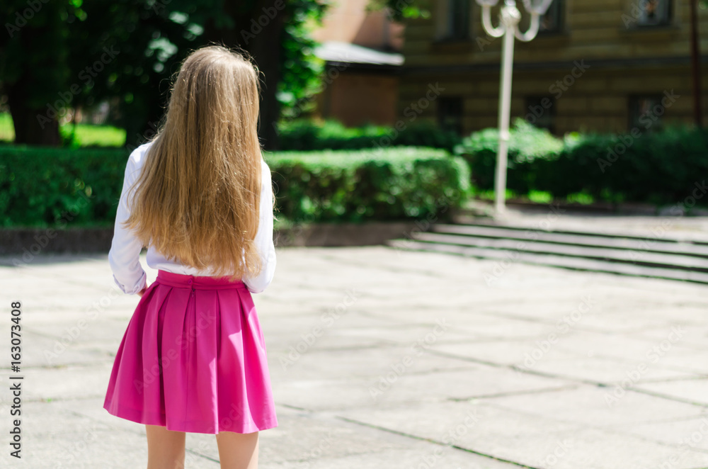 Outdoor summer portrait of a young attractive lady walking in the park Outdoor summer portrait of a young attractive lady walking in the park