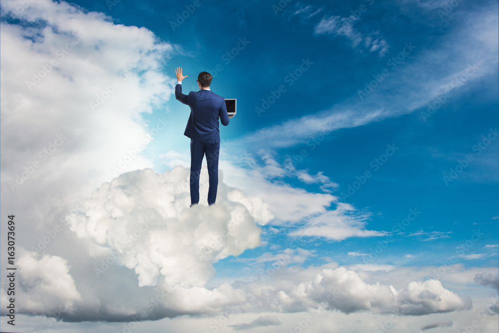 Businessmam pressing virtual buttons in the sky Businessmam pressing virtual buttons in the sky